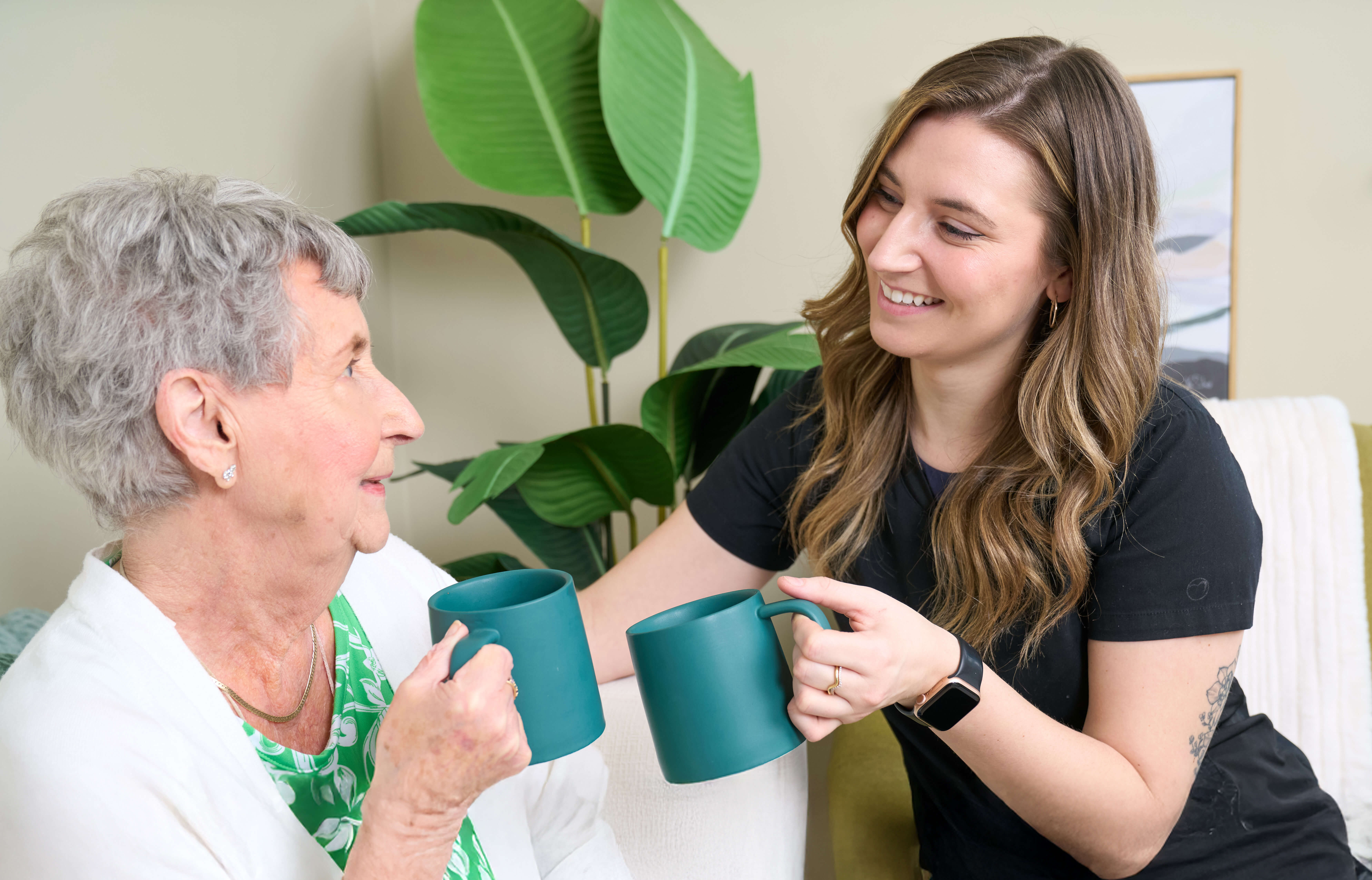 Older woman speaking to staff