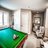 Billiard room at Aspira Empire Crossing Retirement Living