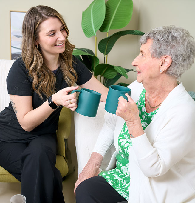 Older woman speaking to staff
